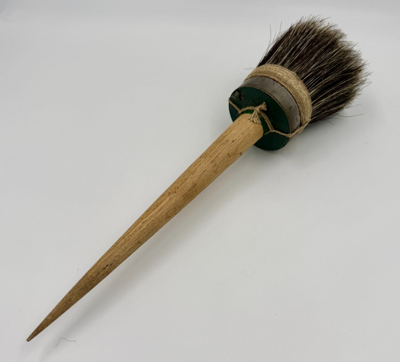 13" French antique paintbrush with a long, wooden handle and horsehair bristles