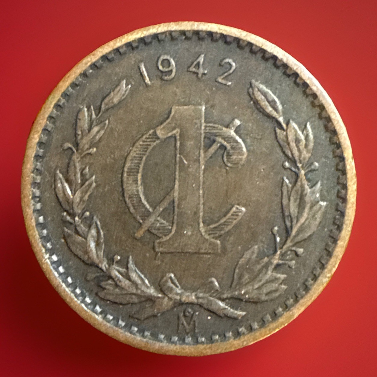 A 1942 Mexico 1 Centavo Coin, as shown in the picture, is being sold. #354