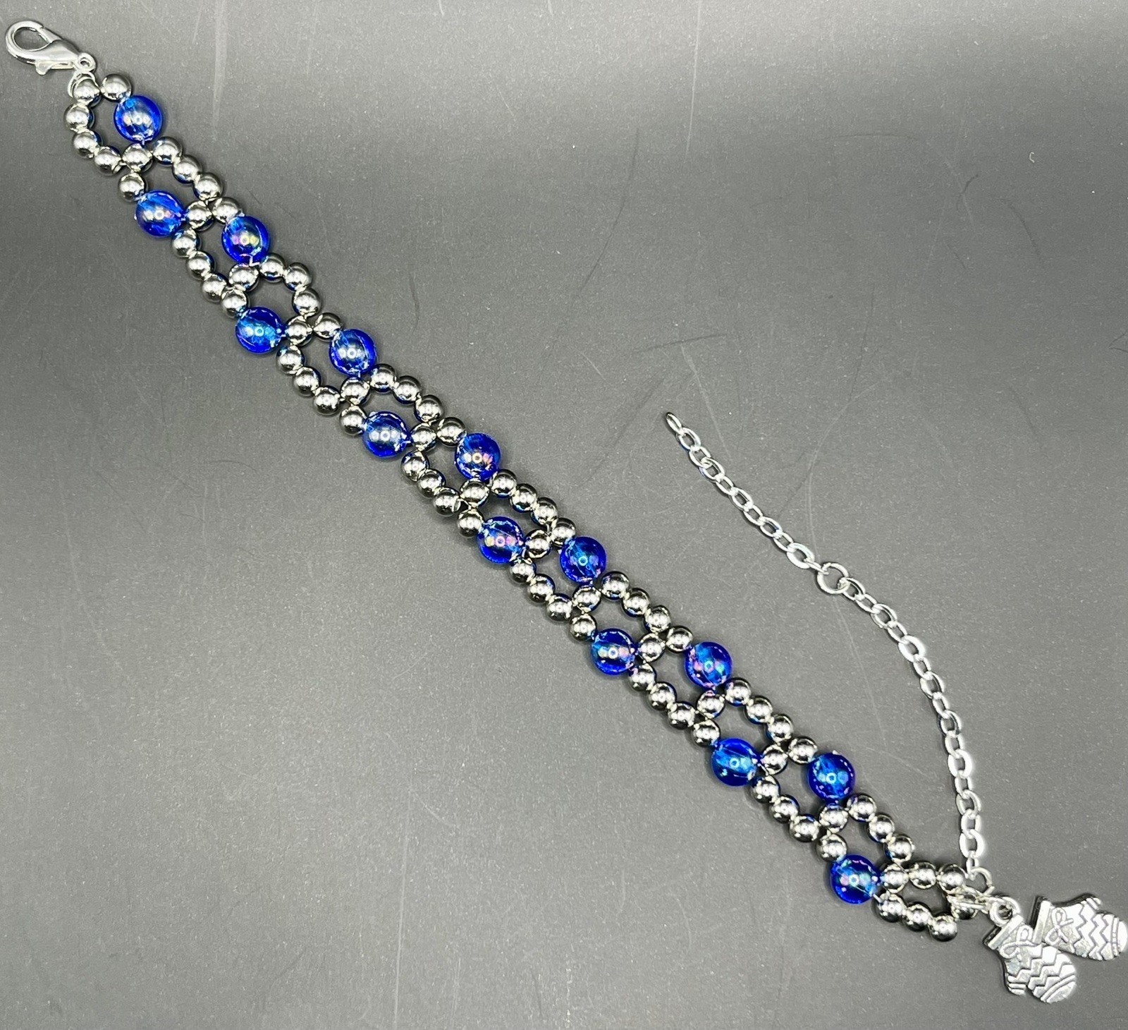 Handmade Beaded Bracelet.  Blue and silver with silver mitten charm