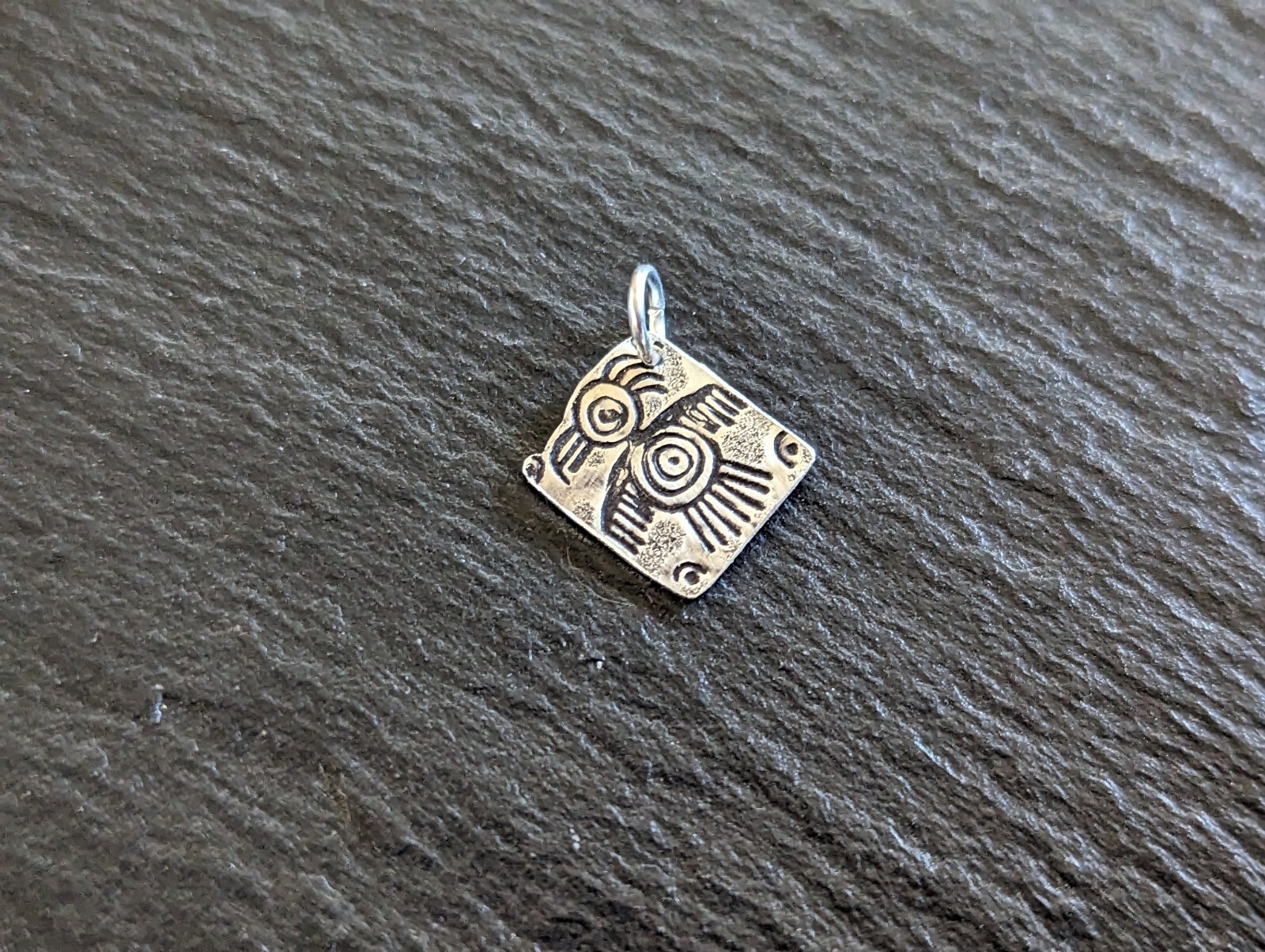 Tiny sterling silver charm with a bird sumbol - handmade - freeform