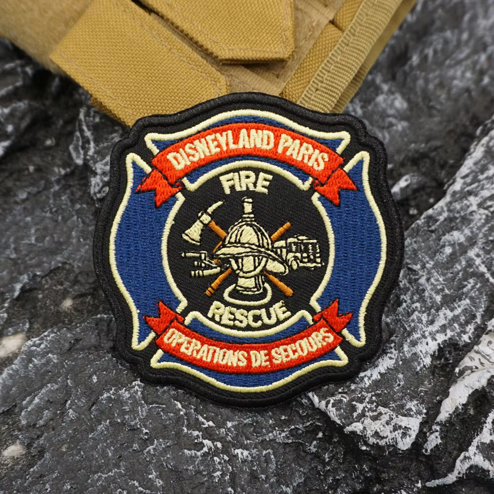 EXTREMELY RARE DISNEYLAND PARIS FIRE AND RESCUE EMBROIDERED IRON-ON PATCH..