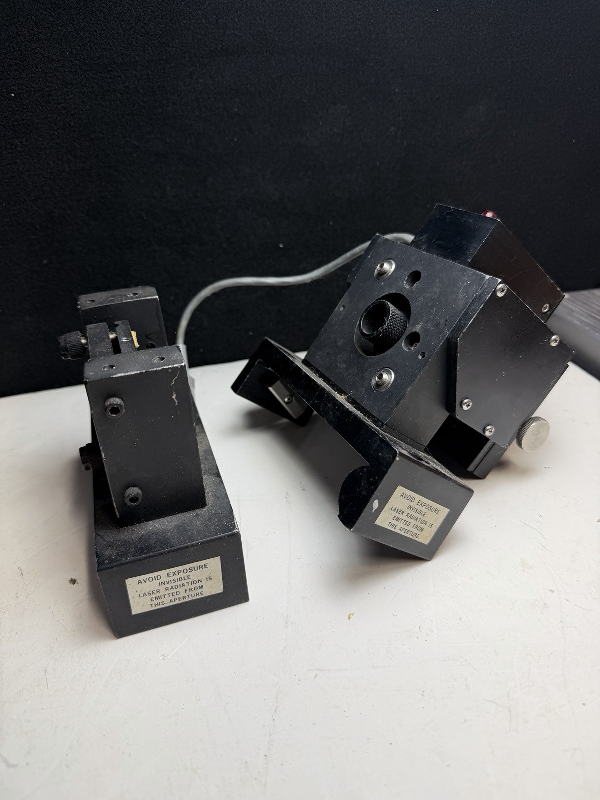 Vintage Laser & Optic stands parts from closed College Laser Lab