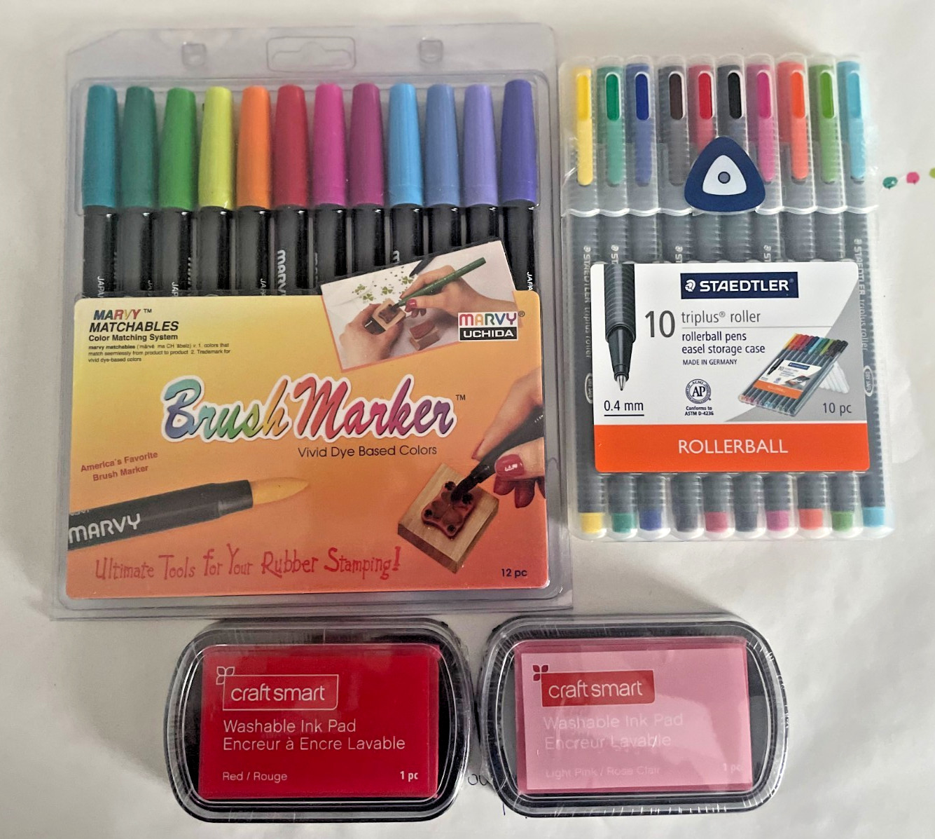 LOT OF 4 STAMPING ACCESSORIES INCL/ BRUSH MARKERS, STAMP PADS, & ROLLER PENS