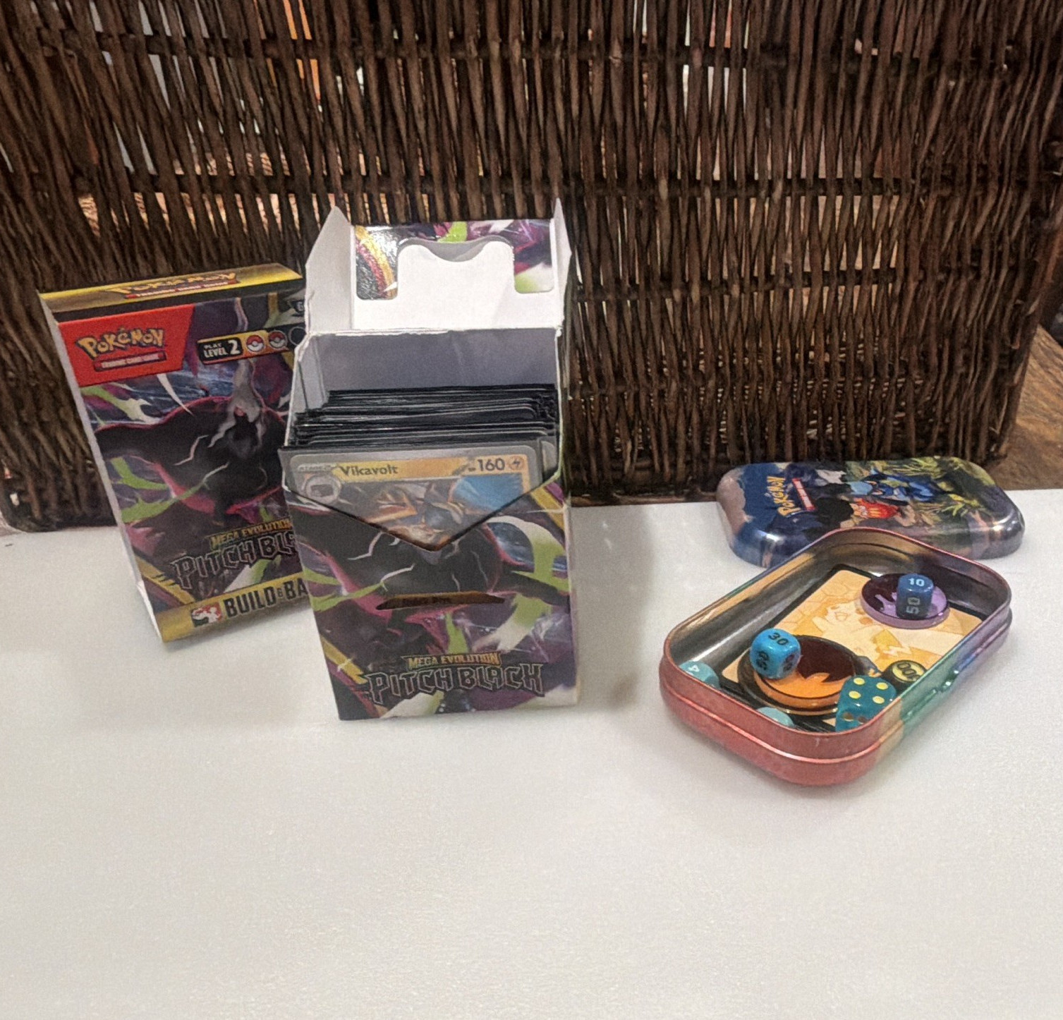 Pokémon TCG starter kit Mega Evolution Pitch Black Deck holder and tin included.