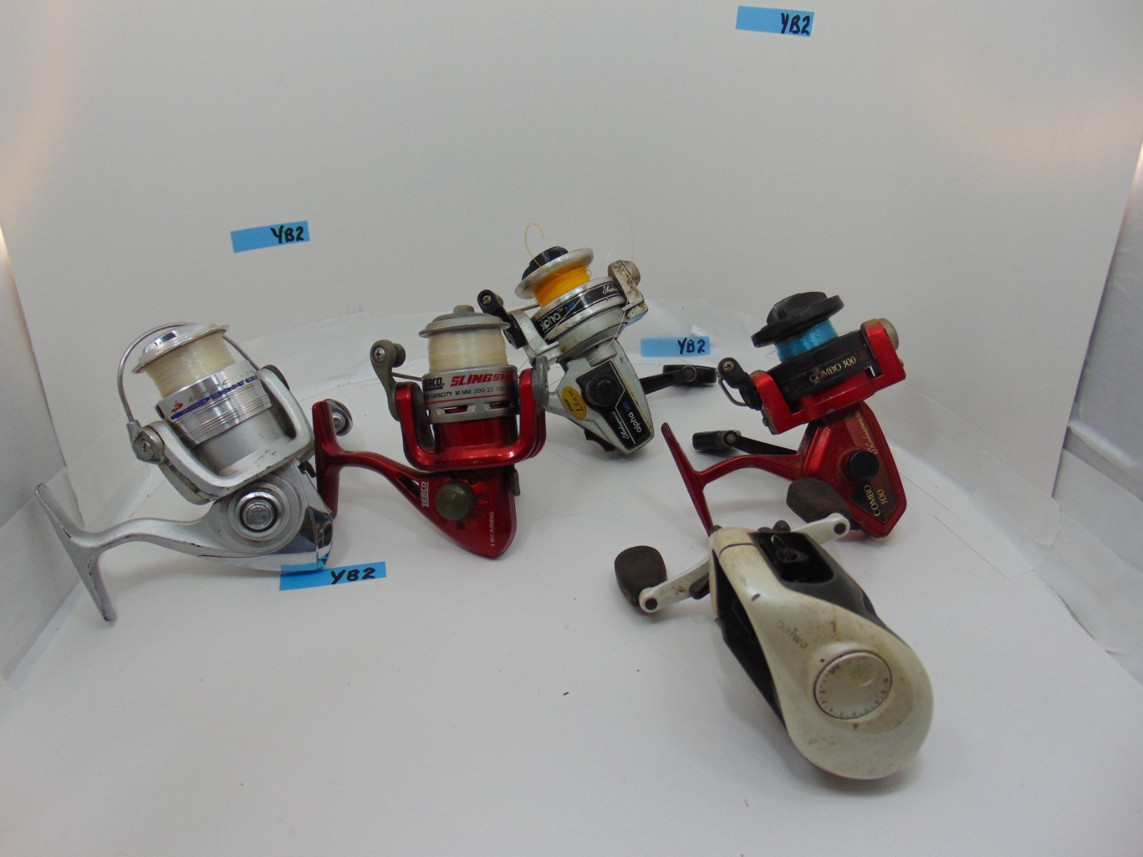 Lot of 5 Fishing Reels , AS PICTURED UNTESTED SOLD FOR PARTS