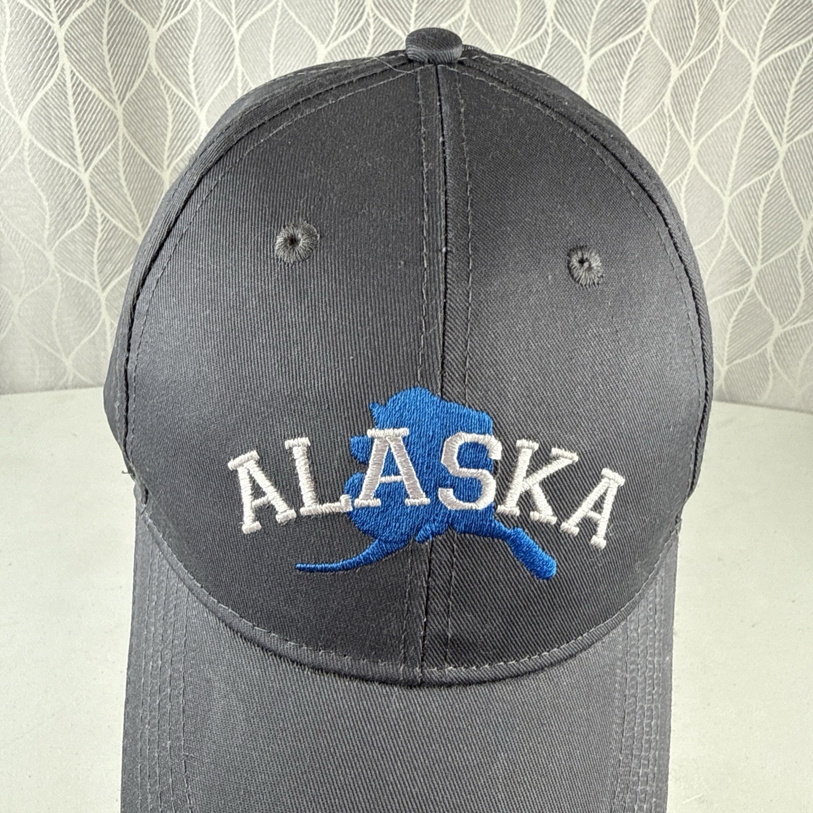 ALASKA in White over Royal Blue State Outline on Gray Hat Cap Hook Loop