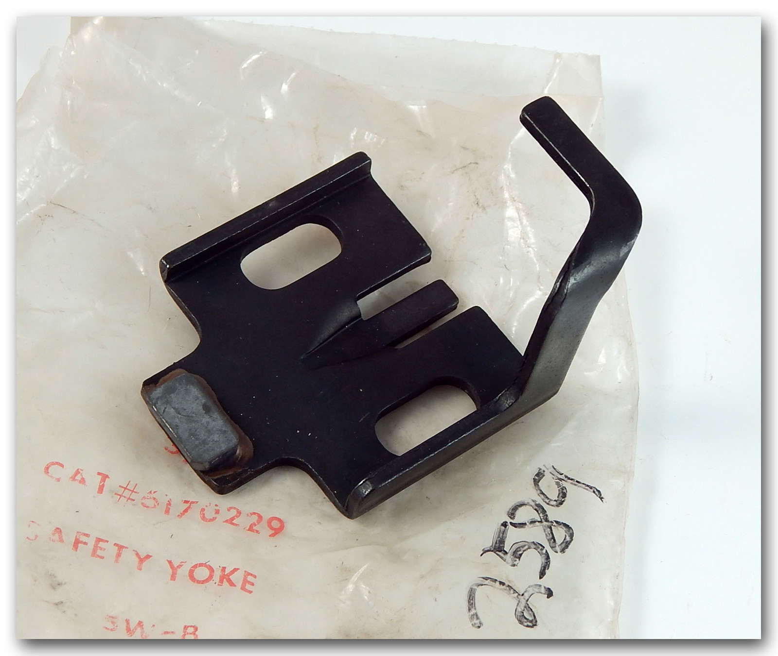 SAFETY YOLK #S 6170229 AND 000132589 SOME TYPE OF POWER EQUIPMENT PART