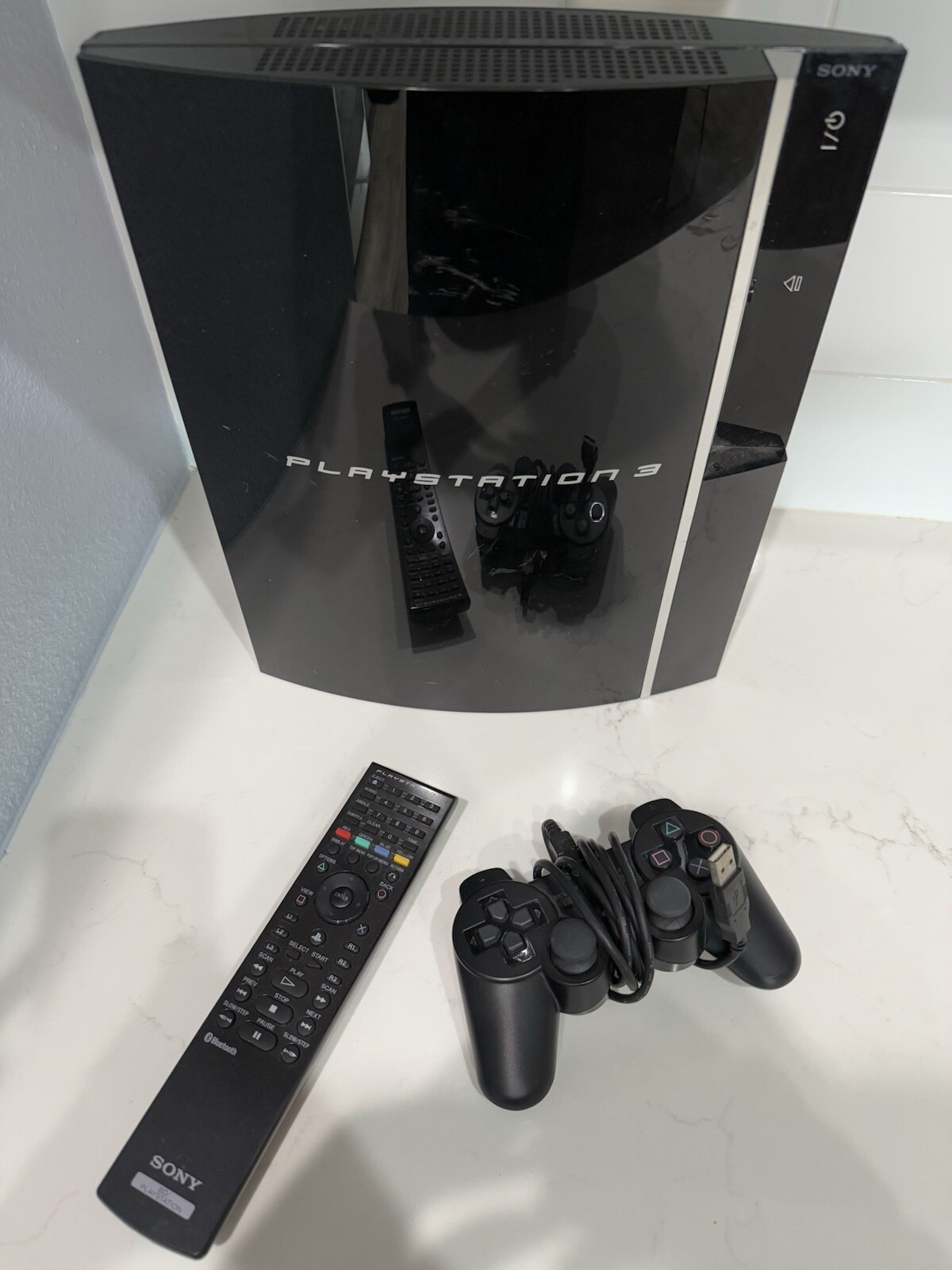 Sony PlayStation 3 with Controller, Power Cord, And Remote