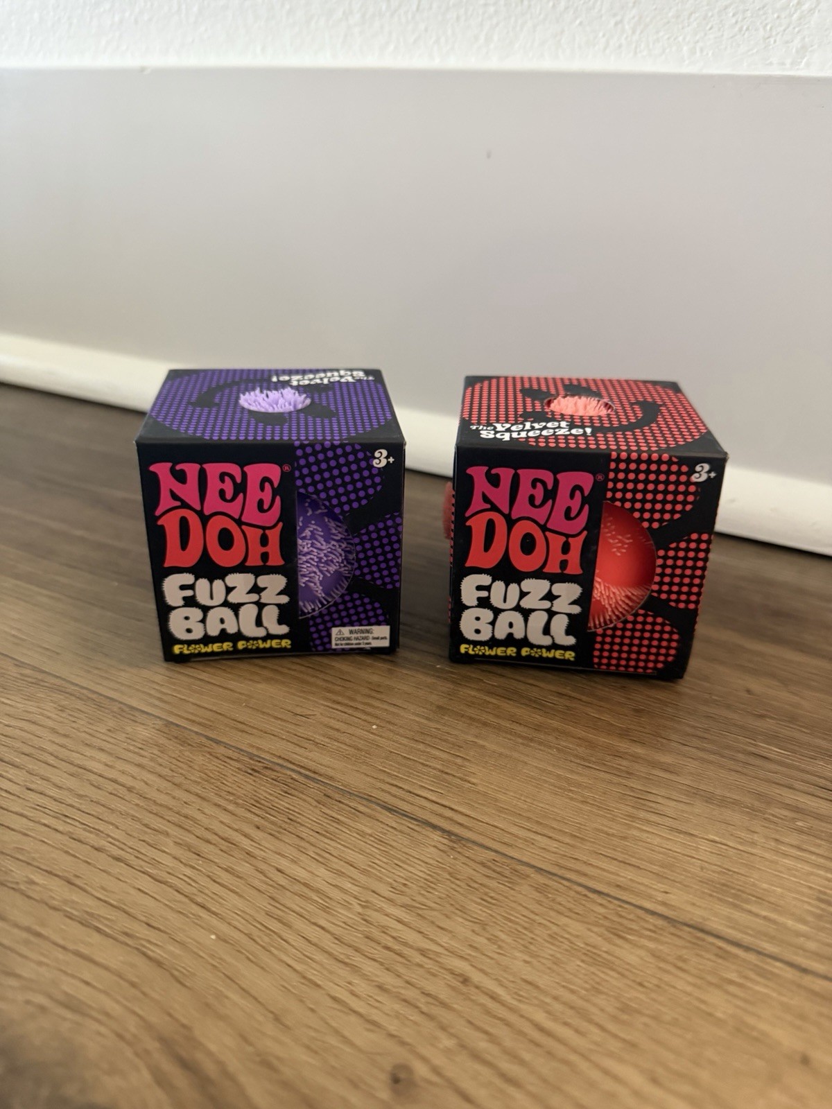 (2) NeeDoh Fuzz Ball’s - pink & Purple