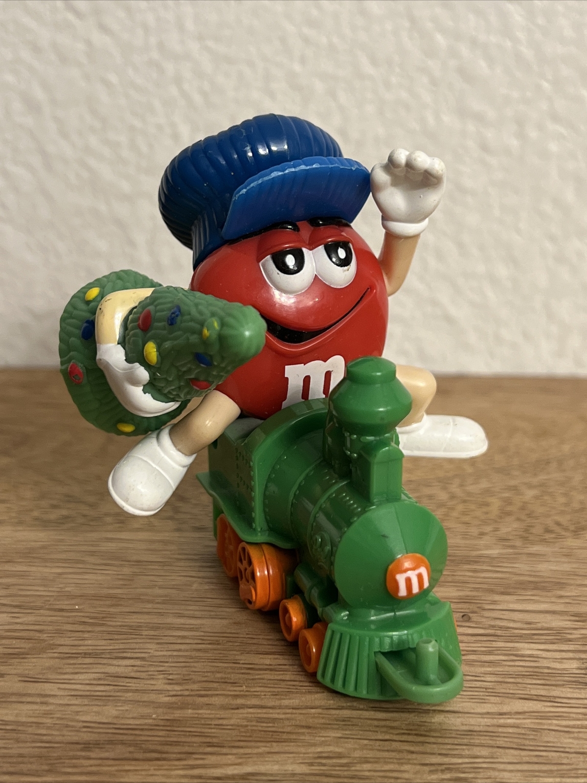 RED M&M FIGURE ON TRAIN HOLDING CHRISTMAS TREE PLASTIC TOY