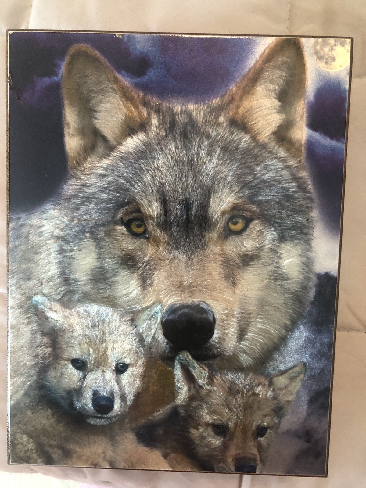 3 wolves with night sky with moon and trees in back ground cedar box great cond.