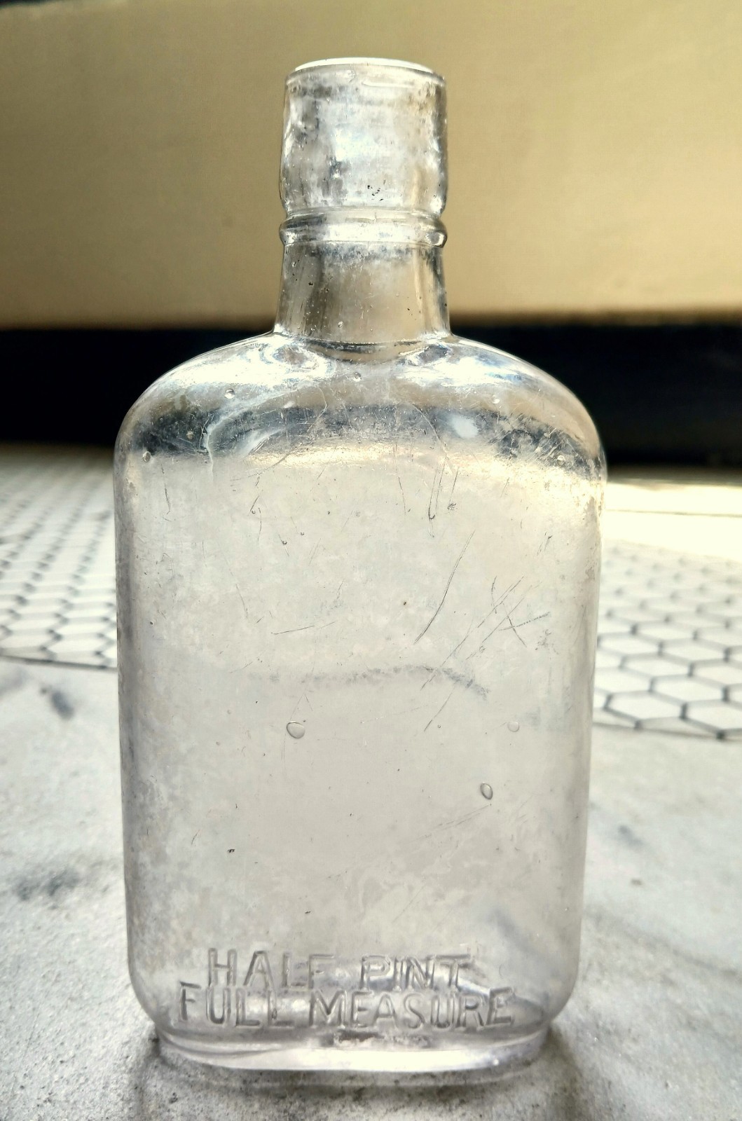 Half pint liquor flask 1910s or earlier