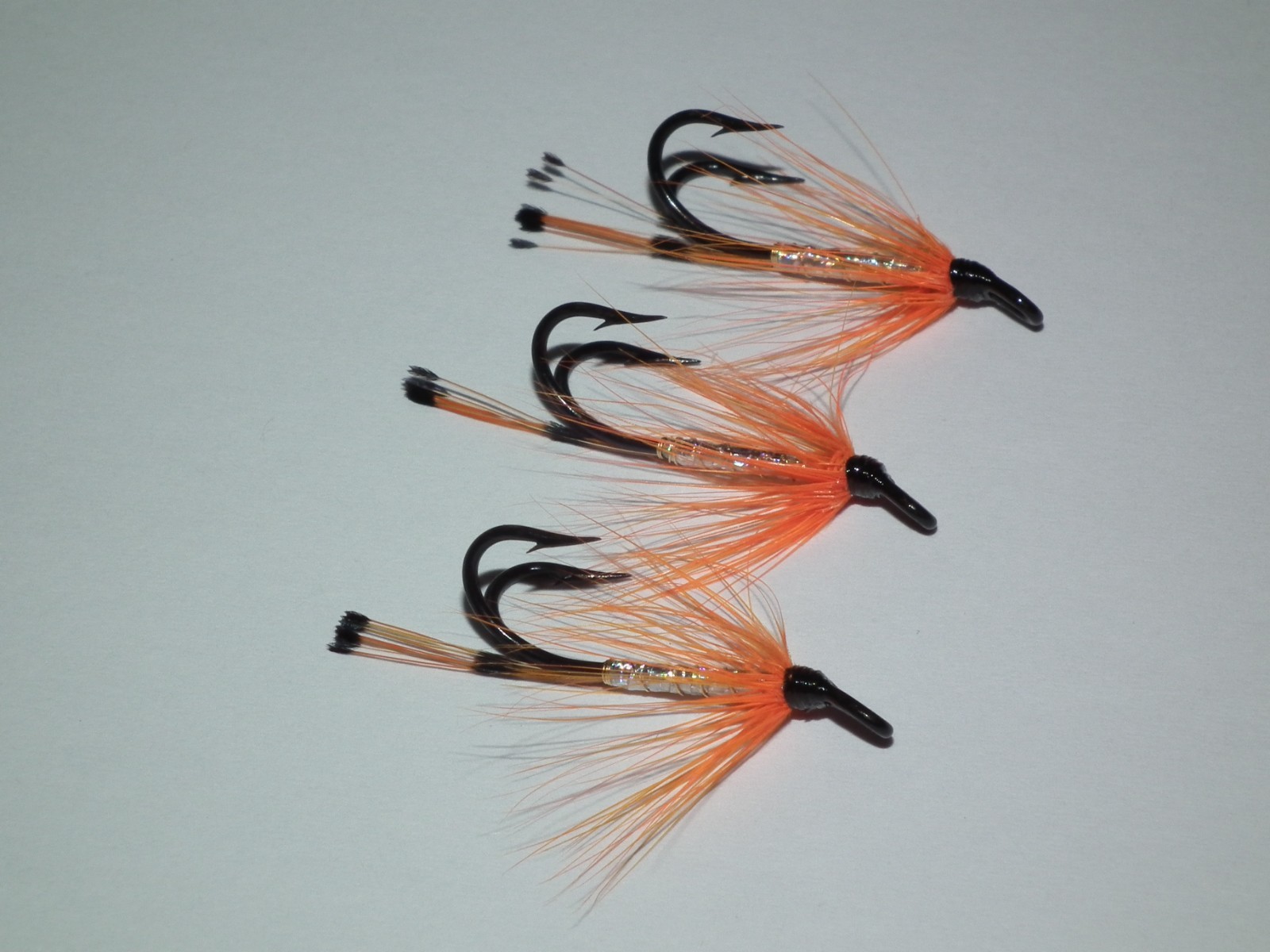 salmon/seatrout flies -- 3 orange & silver tied on  mustad size 10 double hooks