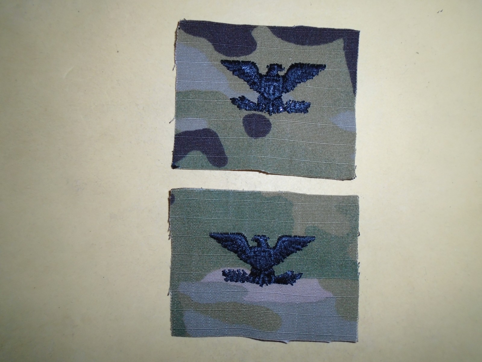 Pair of US Military COLONEL Rank Camo Collar Devices