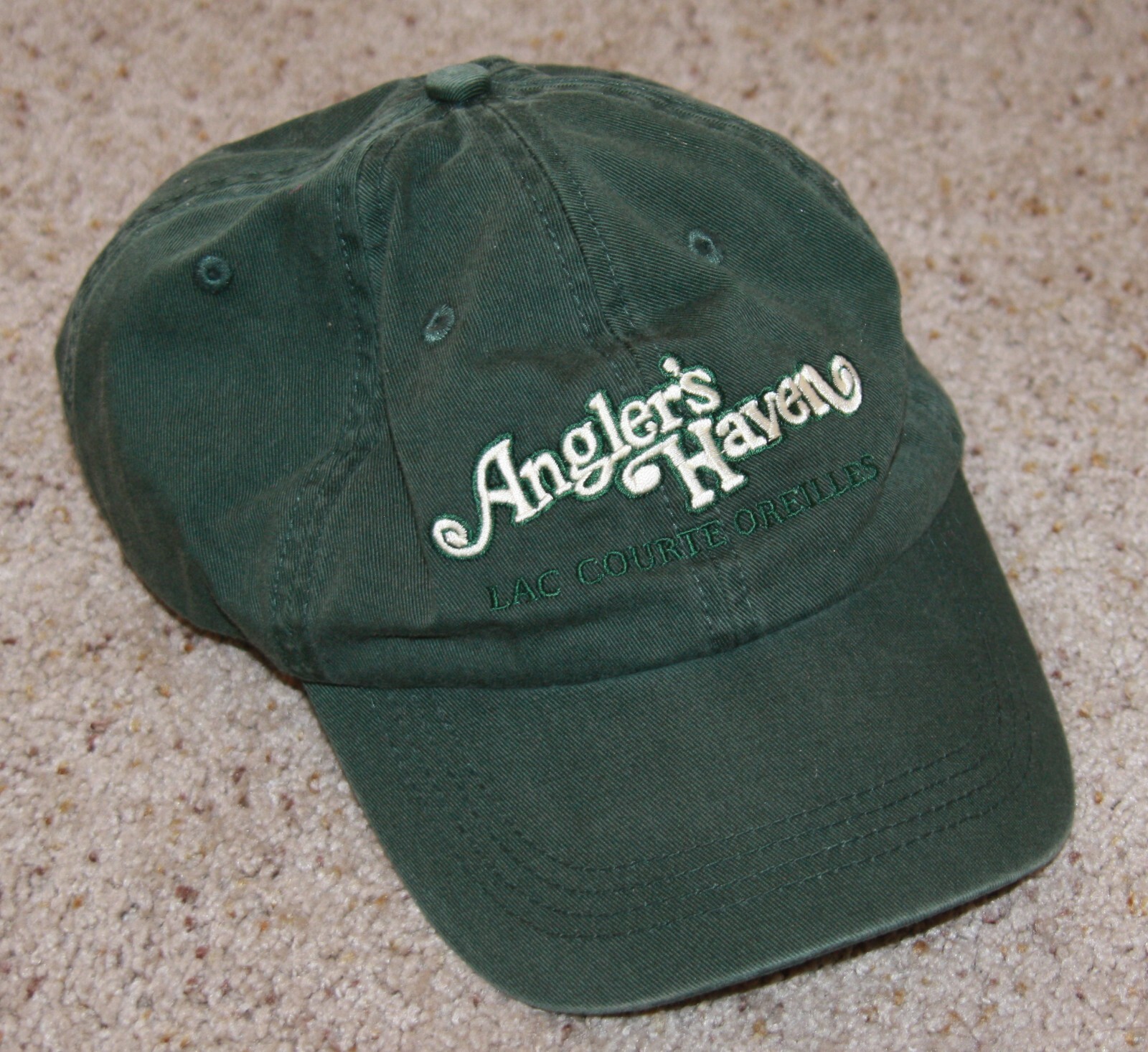 Angler's Haven Lac Courte Oreilles Hayward Wisconsin fishing hat cap green