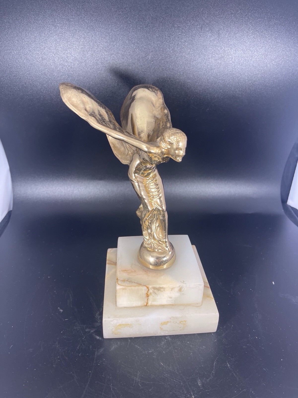 "The Spirit of Ecstasy",  the iconic hood ornament found on Rolls-Royce autos