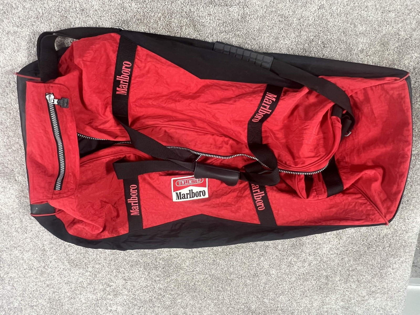 Vintage Marlboro Unlimited Red Black Rolling Duffel Bag Wheeled Luggage Travel