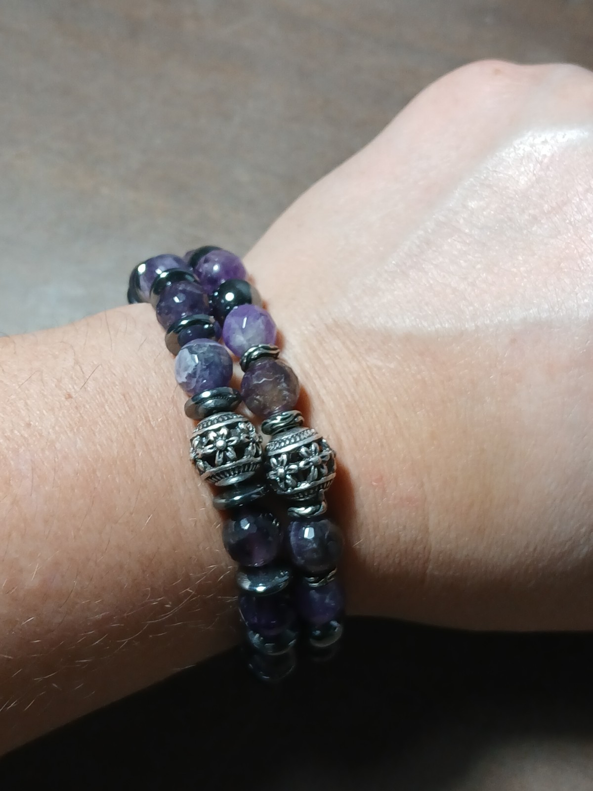 Artisan-style amethyst gemstone beaded bracelet silver-toned filigree beads.
