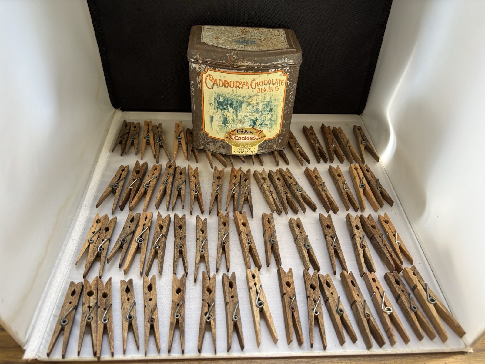 Vintage Antique Wooden Clothes Pins Lot Of 62. Cadbury Tin Included!