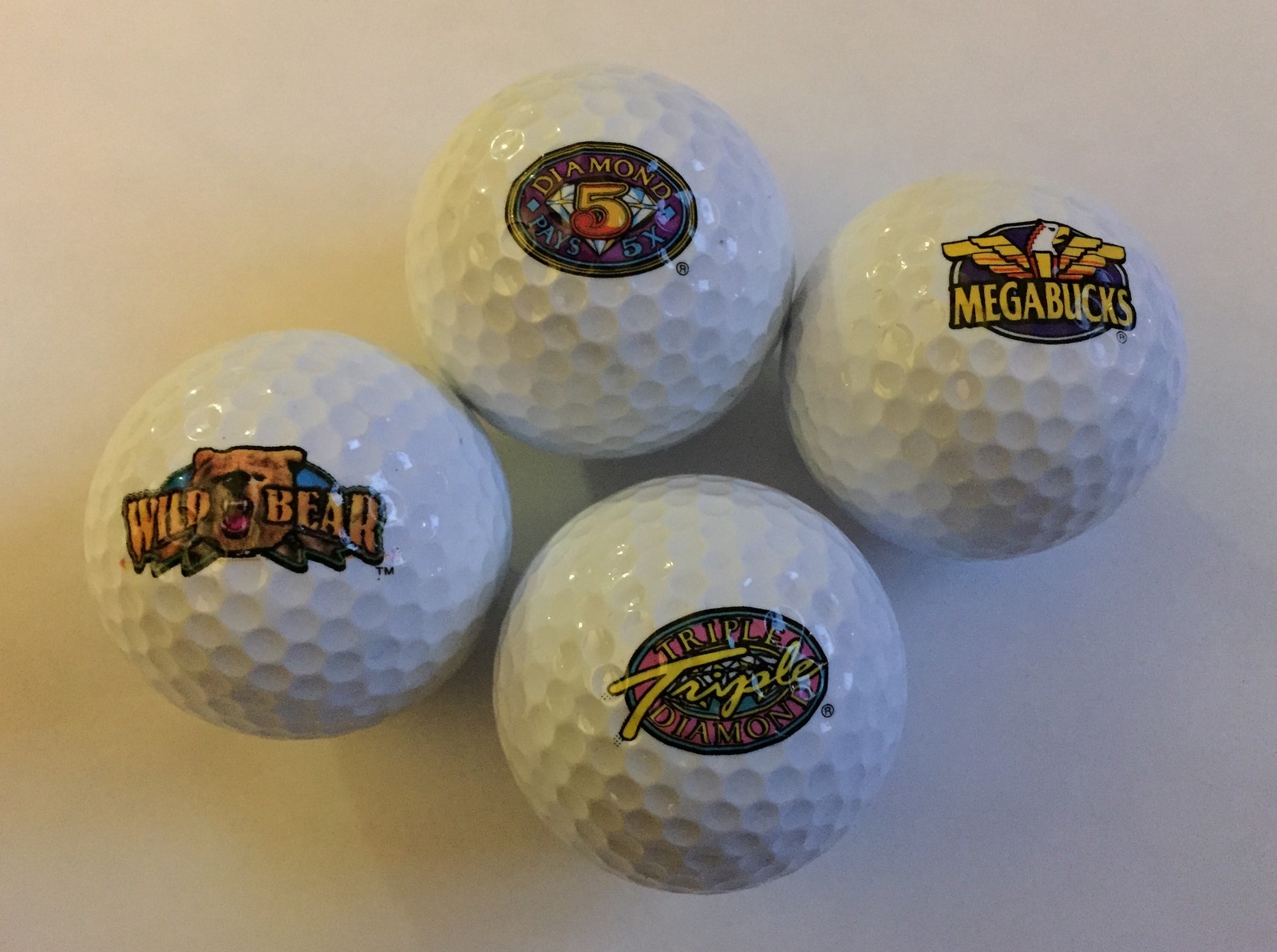 IGT Logo Golf Ball Set of 4 Las Vegas Casino Slots Mega Bucks Triple Diamond