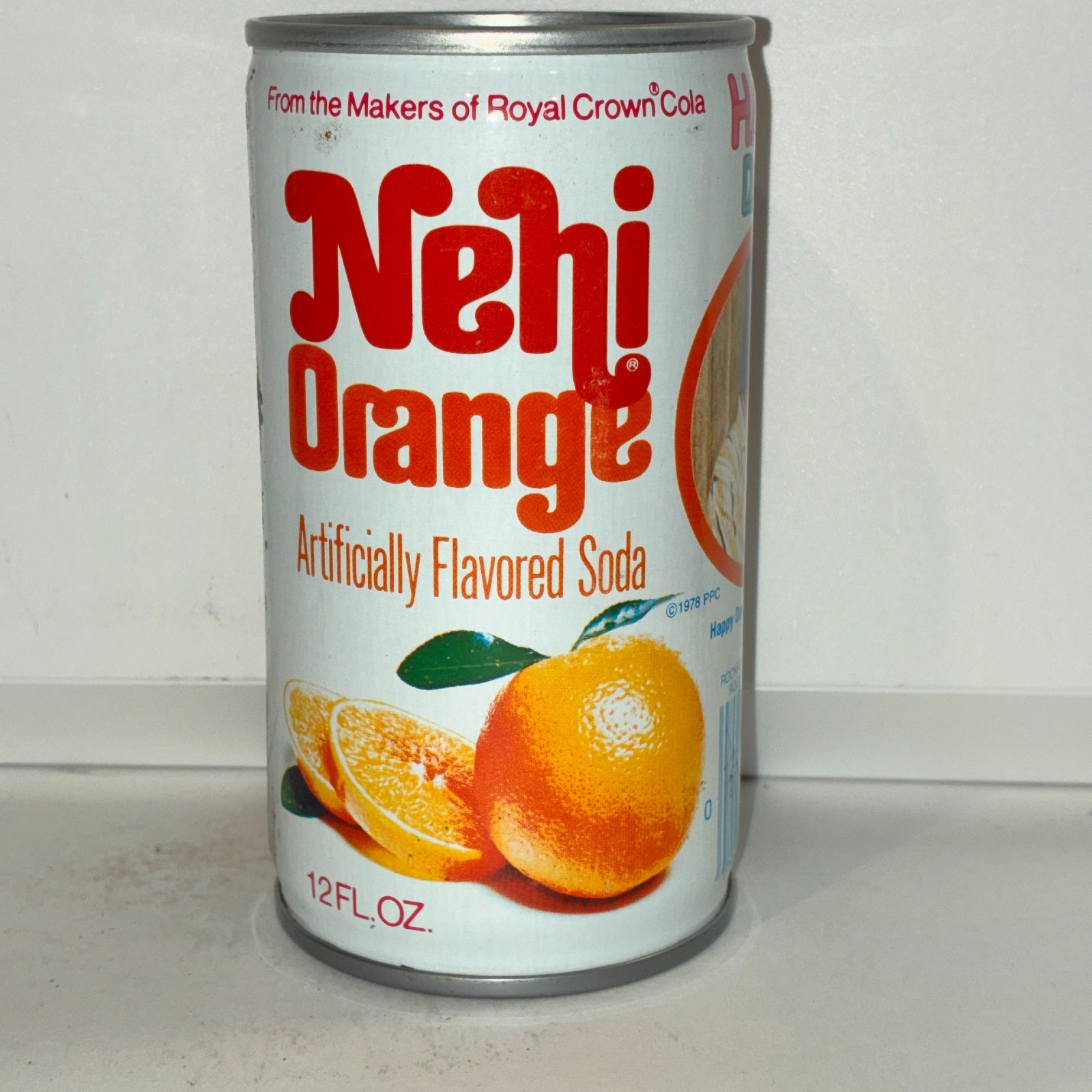 1970's Nehi Happy Days Orange Soda can, #11, bottom opened
