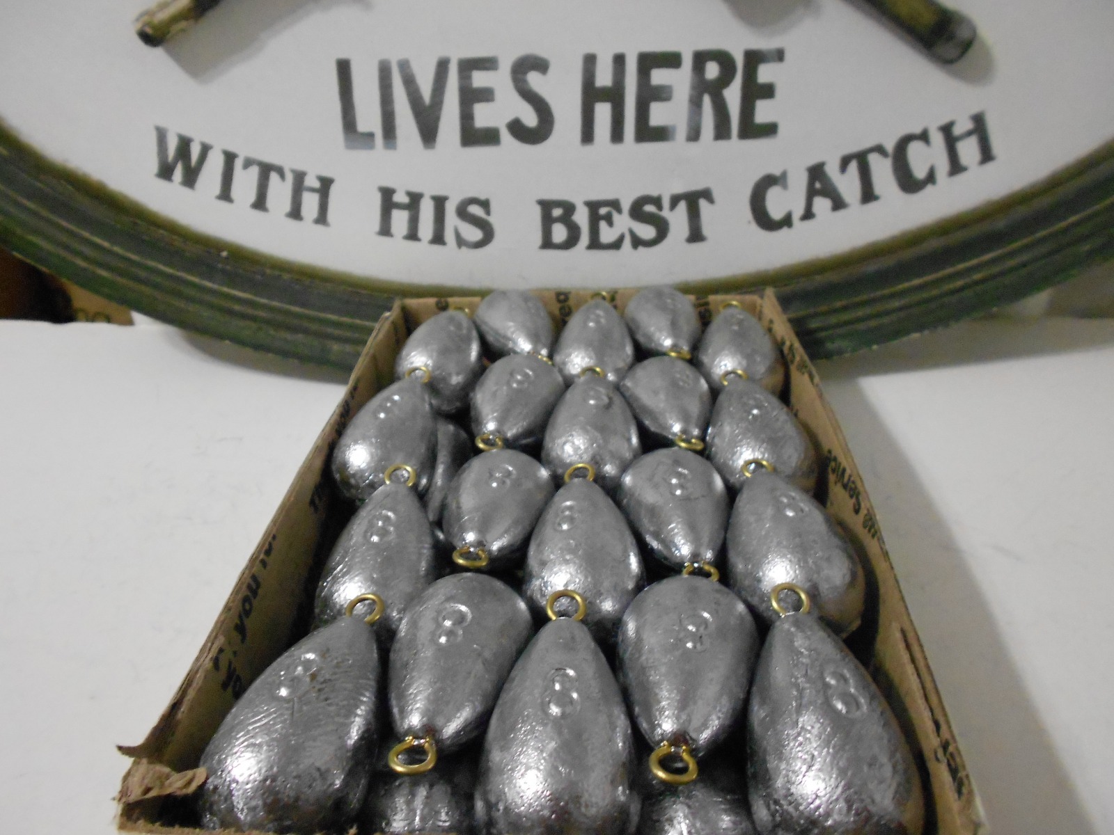 28-  8 oz  BELL SINKERS  WITH BRASS EYES