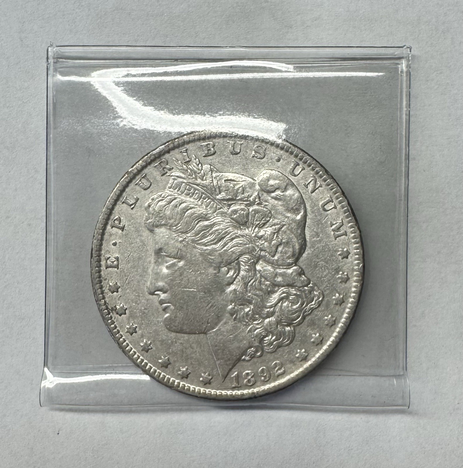 1892 O Morgan Dollar - Slightly Bruised Rim