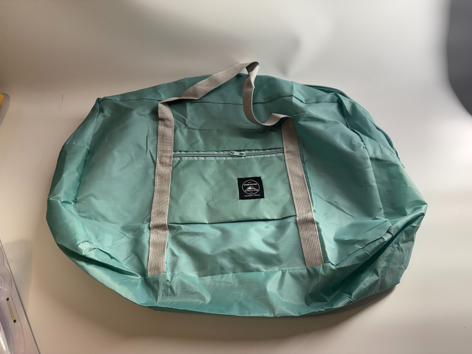 WIND BLOWS RIVER FLOWS Walking in the Air Travel Bag Teal Mint Green Blue NWOT