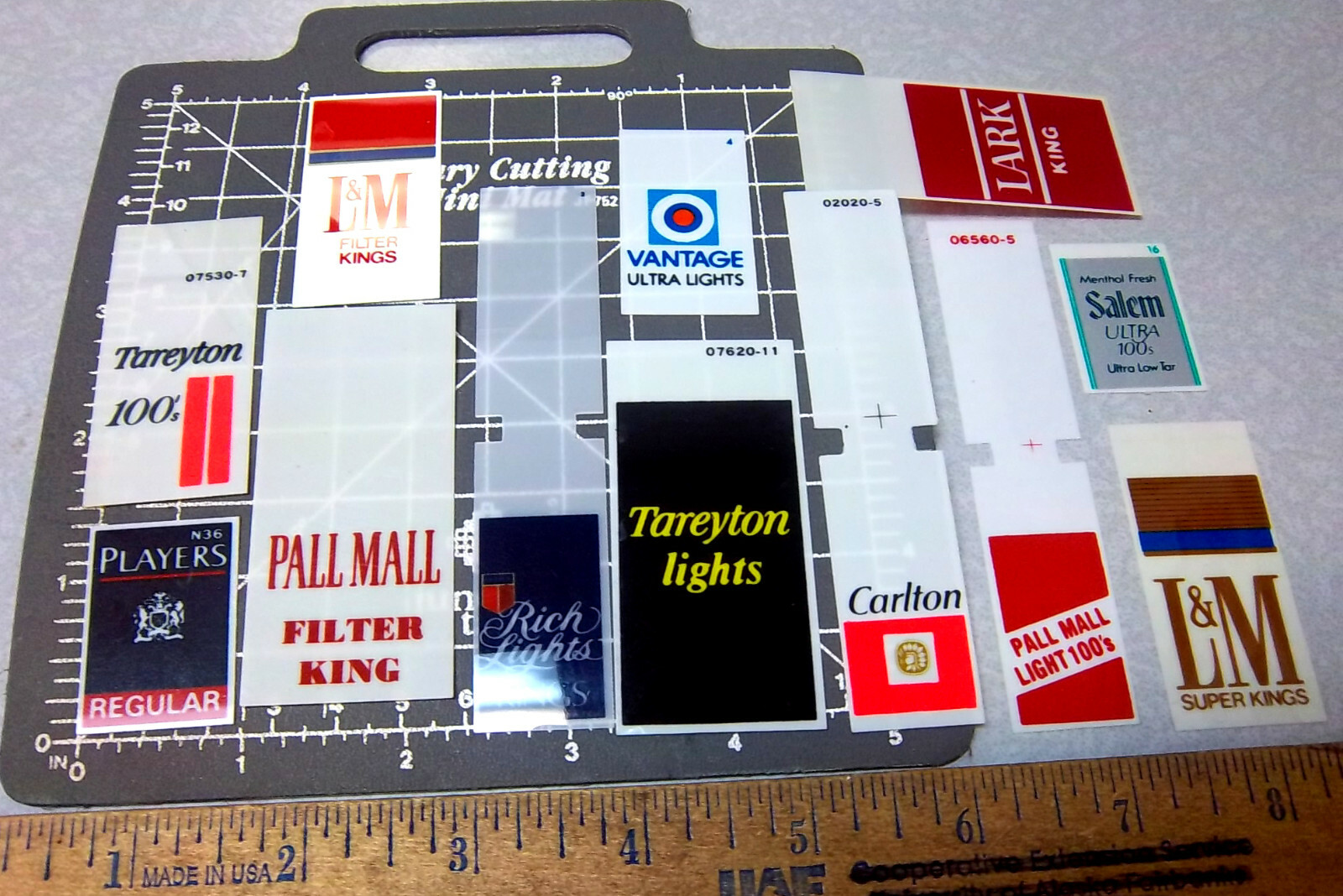 set of 12 NEW plastic signs that went in the front of cigarette vending machines