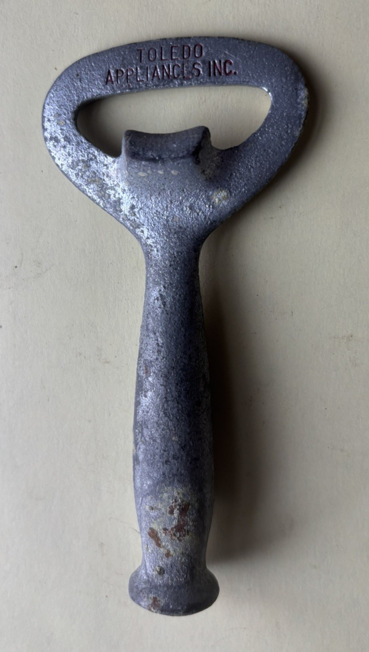 TOLEDO APPLIANCES INC. CAST IRON BOTTLE OPENER, OLD!! NEAT!!