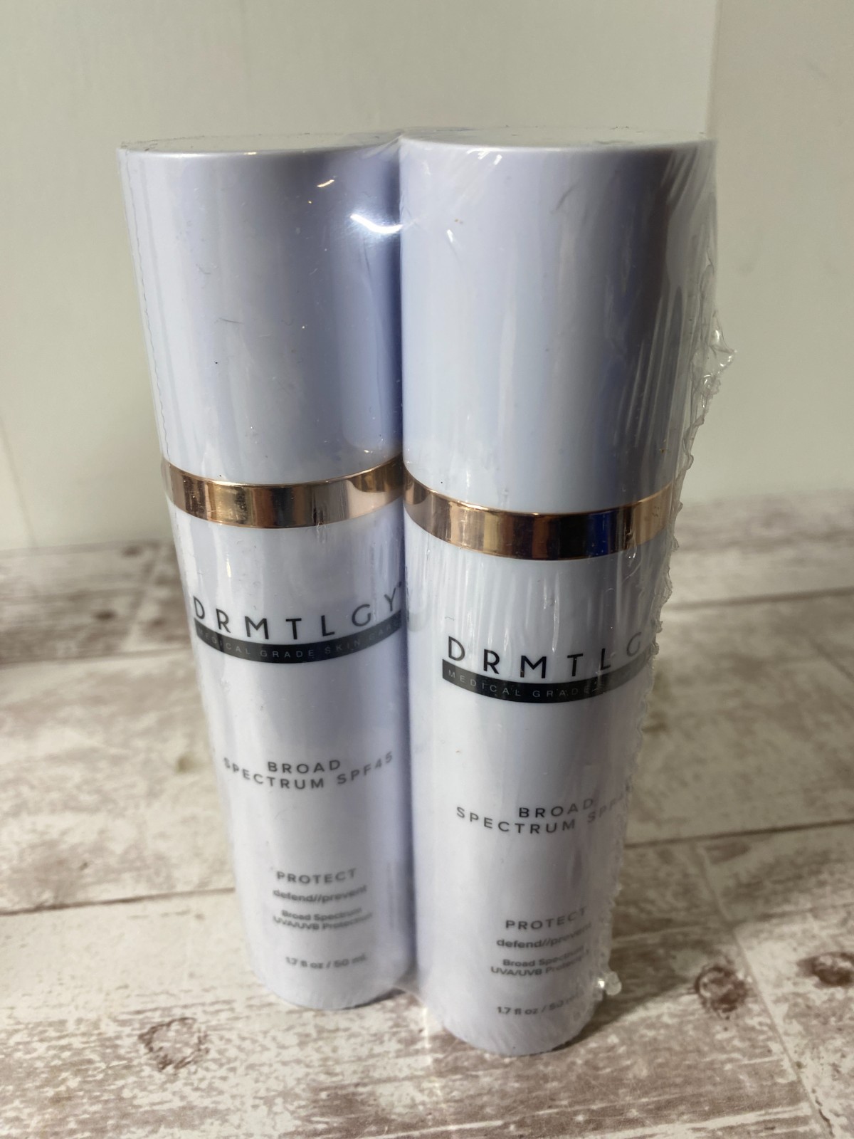 2 Pack DRMTLGY Broad Spectrum SPF 45 PROTECT - 1.7 fl oz - EXPIRES 11/2026