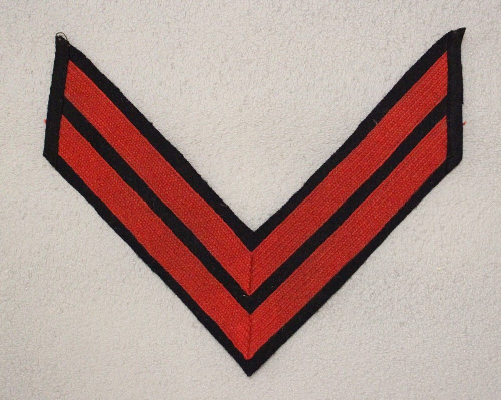 U.S. Army SAW style Chevron - Corporal, red lace on black wool (036)