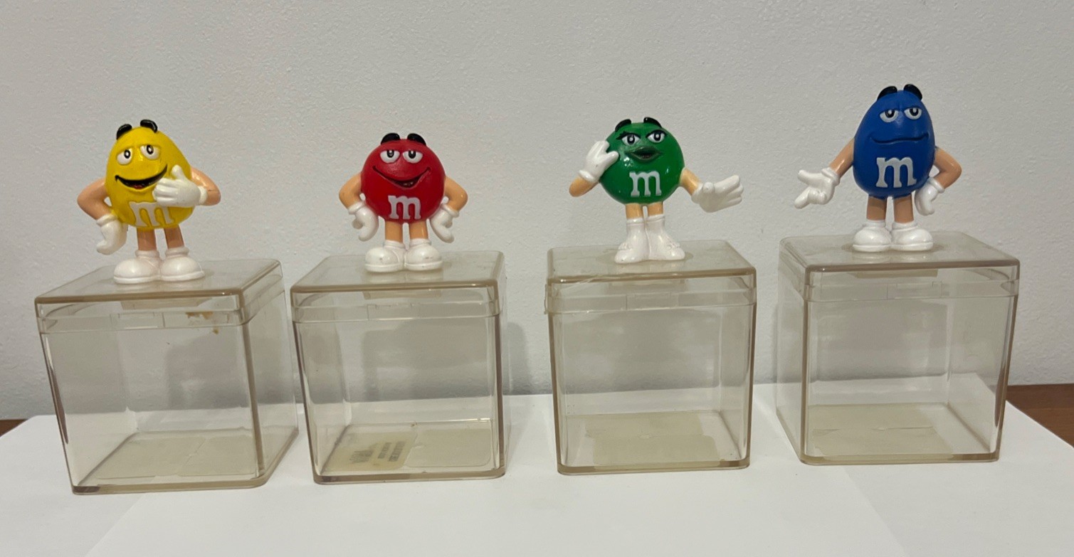 Set Of 4 Small Clear Containers With M&M Characters On Top