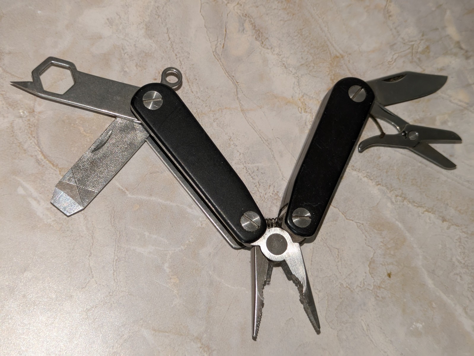 Black STRIKE KING Multi-Tool with Pliers File Scissors & More