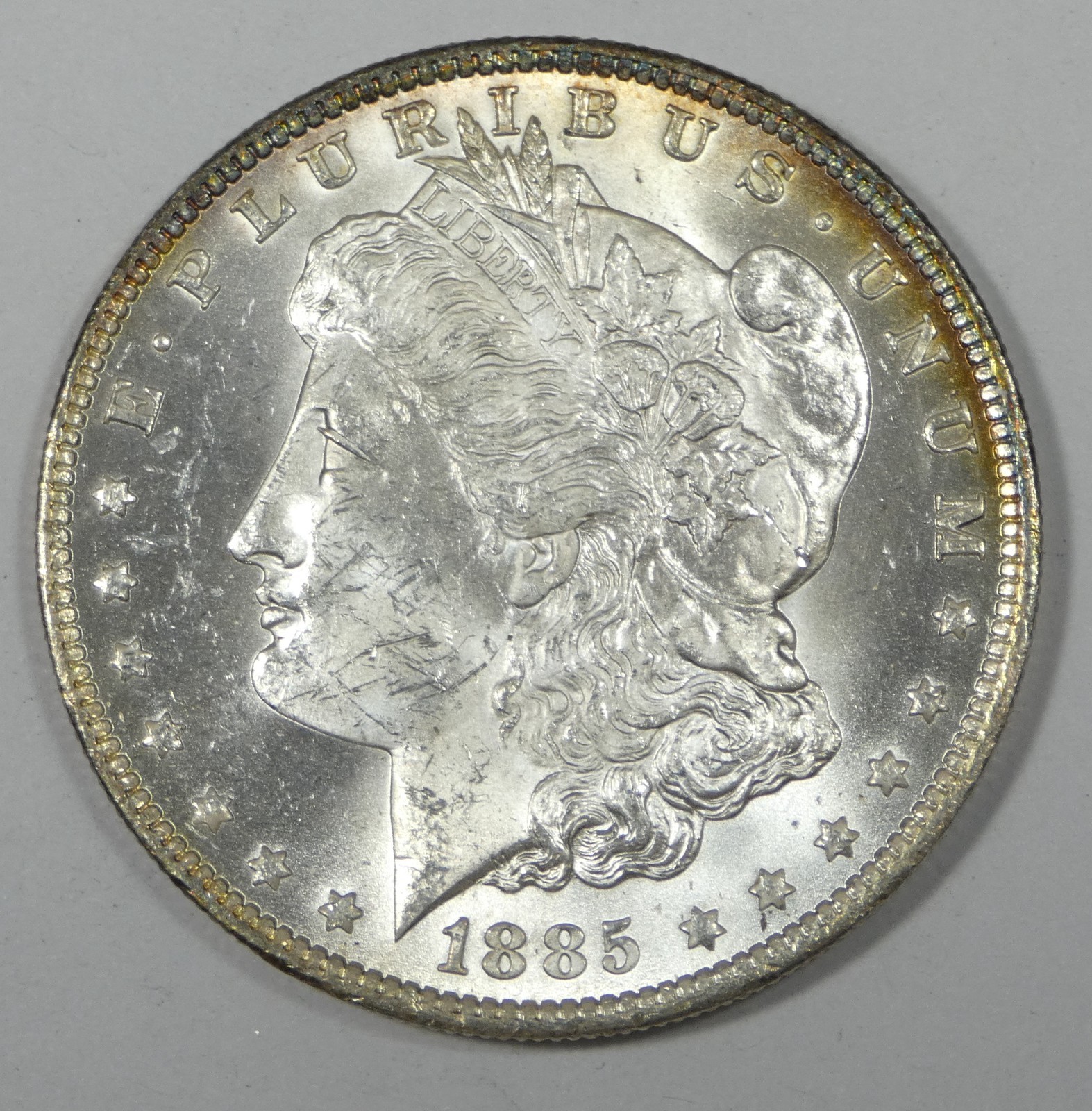 1885-O Morgan Silver Dollar Nice BRILLIANT UNCIRCULATED ~ Peripheral Golden Tone