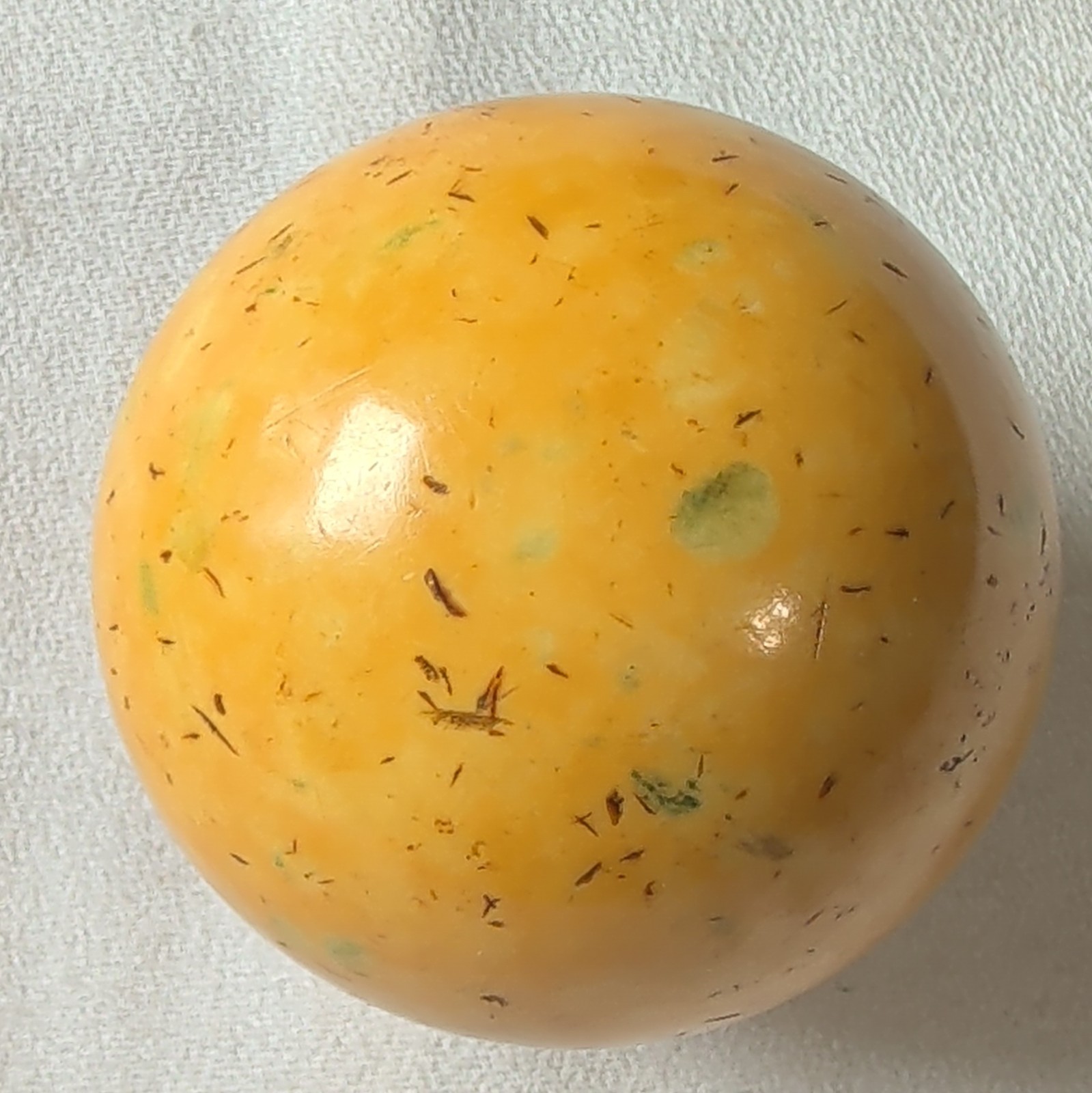 Antique Billiard Cue Ball, yellow speckled with orange hue