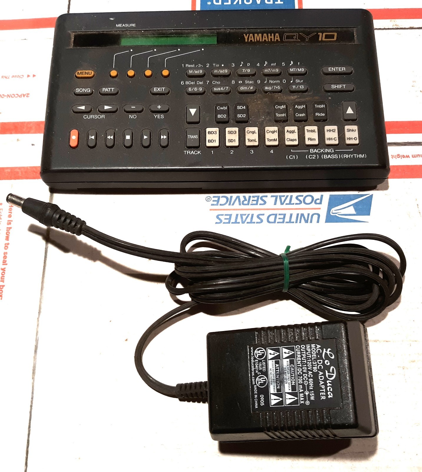 Yamaha QY10. Powers up, Not Tested. + Good Power Adapter. Missing Battery Cover.