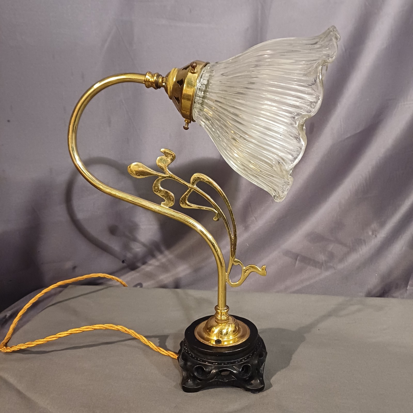 Art Nouveau brass swan neck lamp. Original ornate heavy frilled glass shade.
