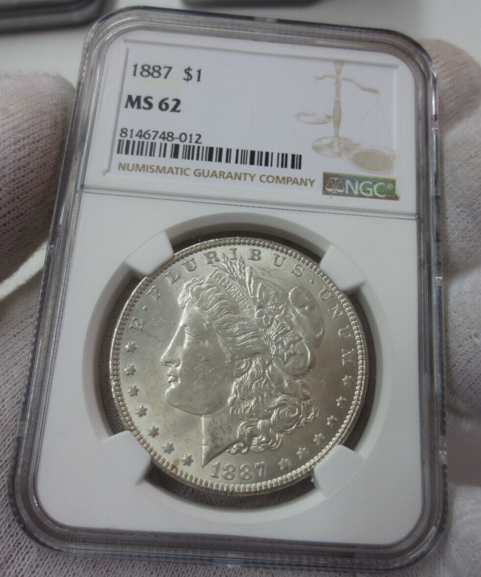 1887P Morgan Dollar NGC MS62 (012)(Die Breaks around lettering on REV & light pi