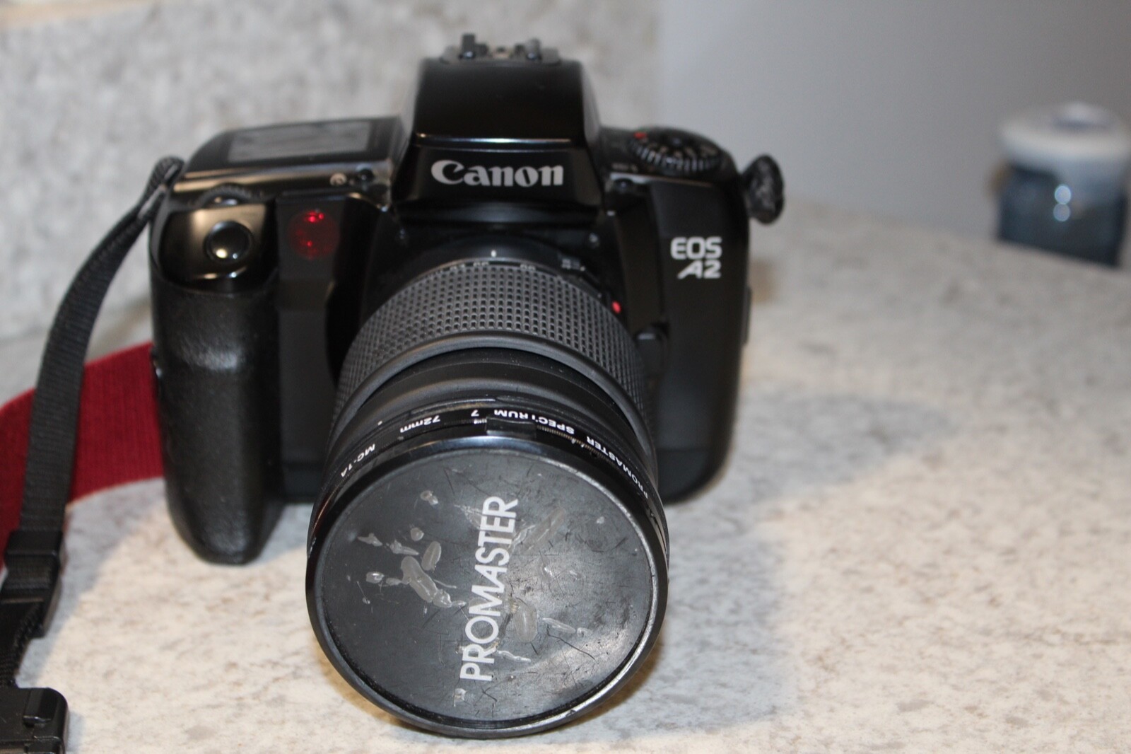 Canon EOSA2 Camera With- 72mm Promaster Lens W/ Strap & Case Bundle