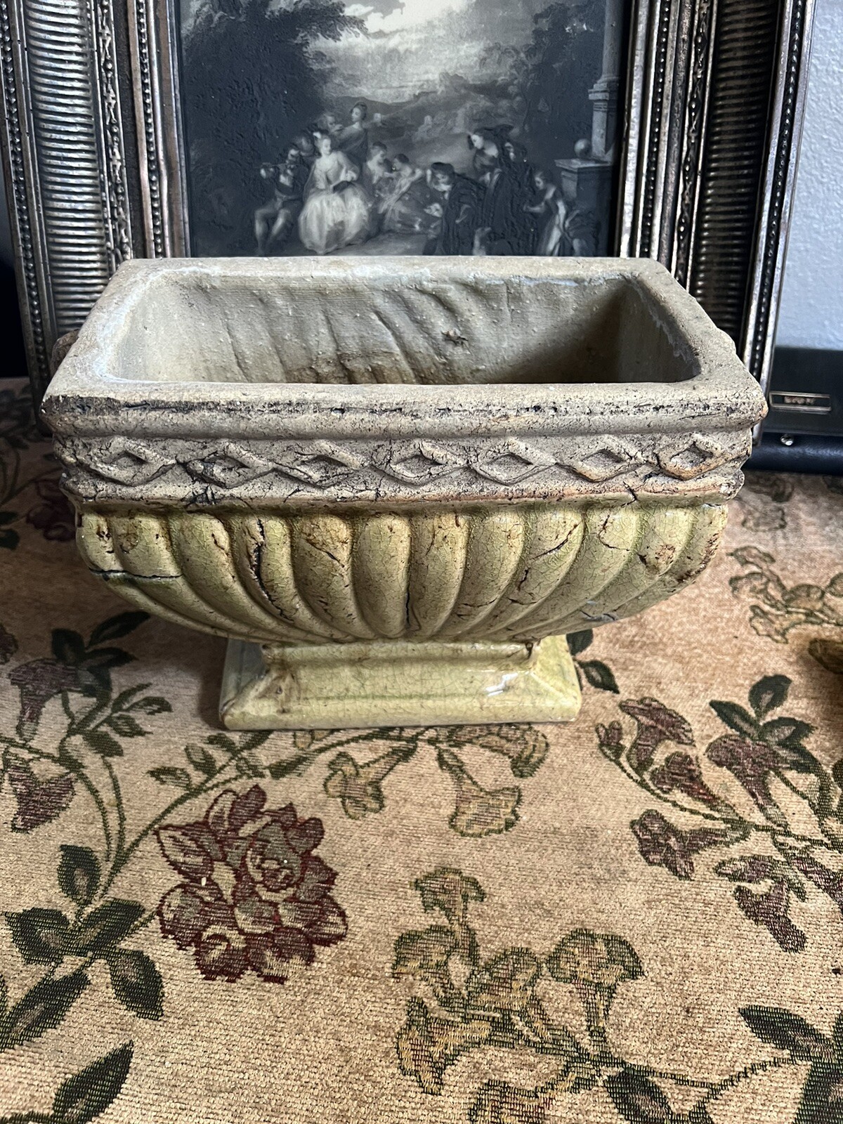 Vintage French Style Garden Urn Planter with figures on the sides of cherub