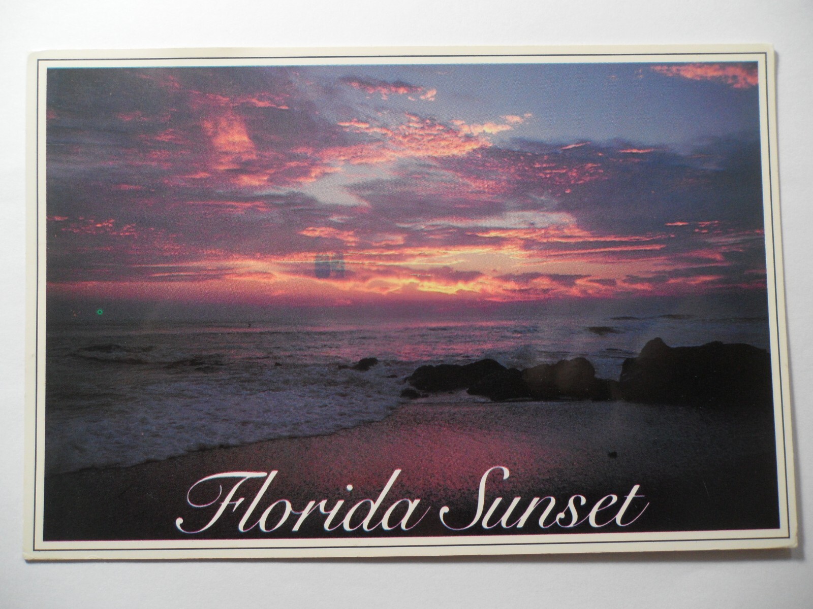 STAMPMART : USA GREETINGS FROM COLORFUL SUNSET FLORIDA USED POSTCARD