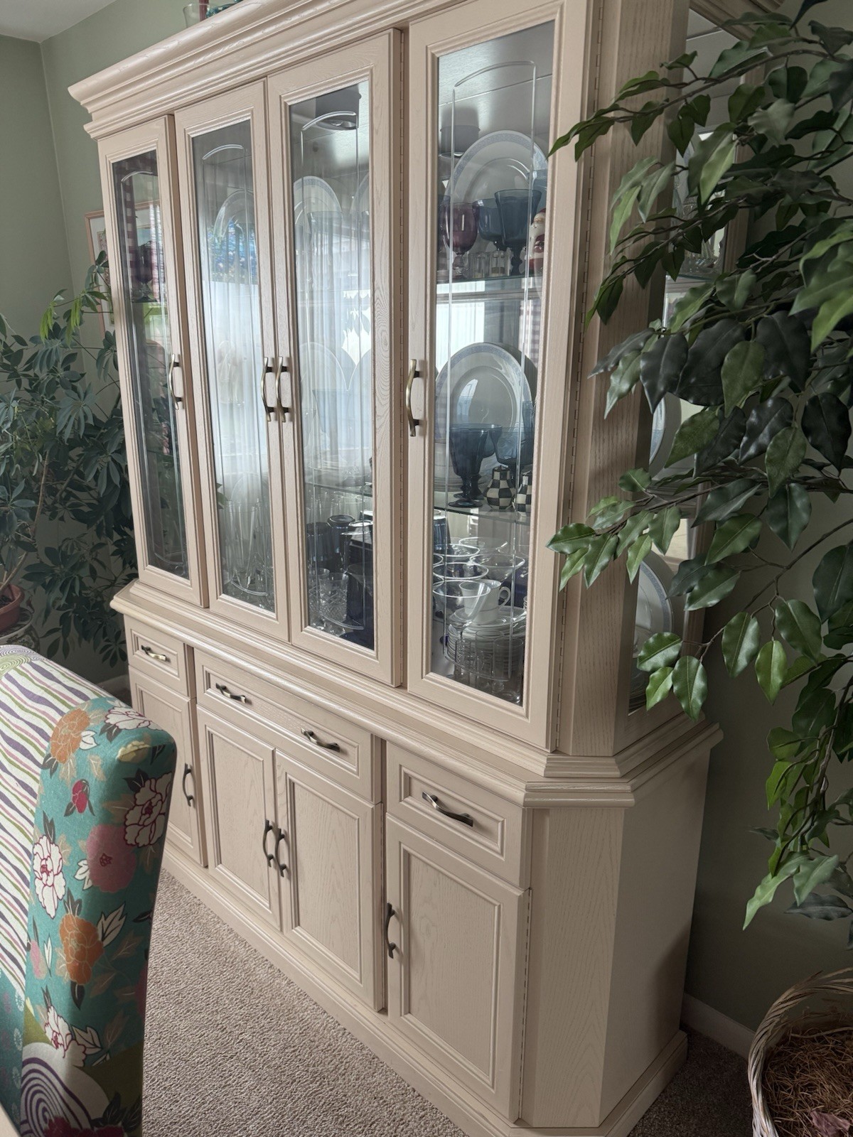 dining room set 6 chairs  and lighted hutch ,table has leaf stored inside