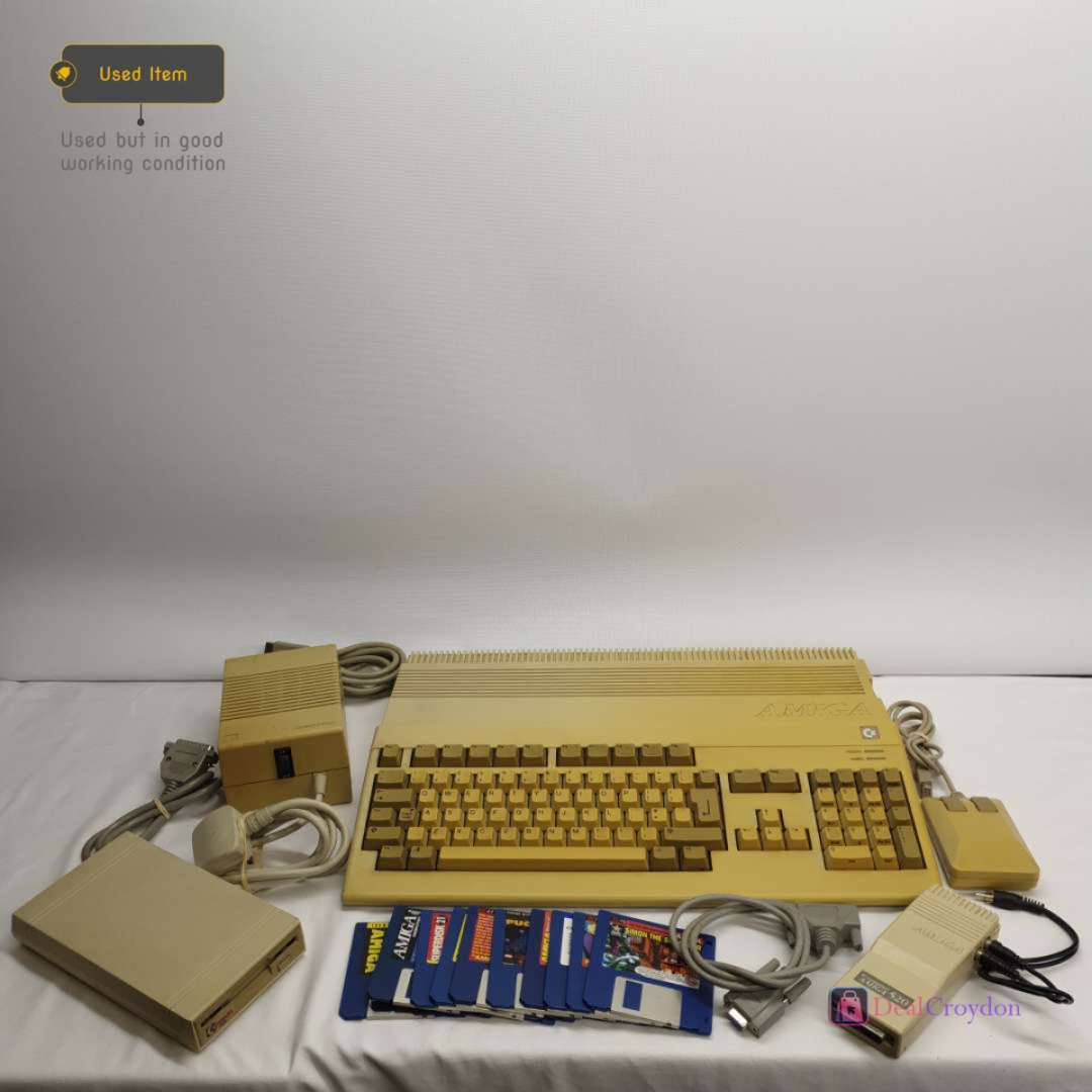 COMMODORE AMIGA A500 COMPUTER +COMMODORE A520 +MOUSE + 10 DISKS + POWER SUPPLY