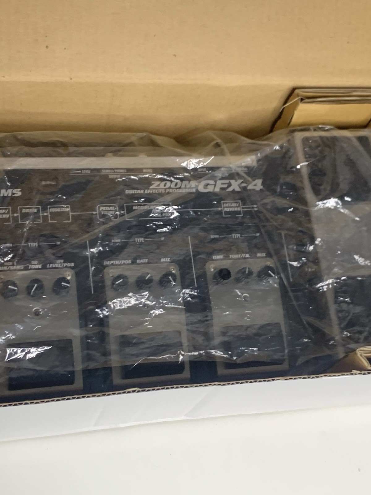 Zoom GFX-4 guitar effects processor packaged in its original white Box