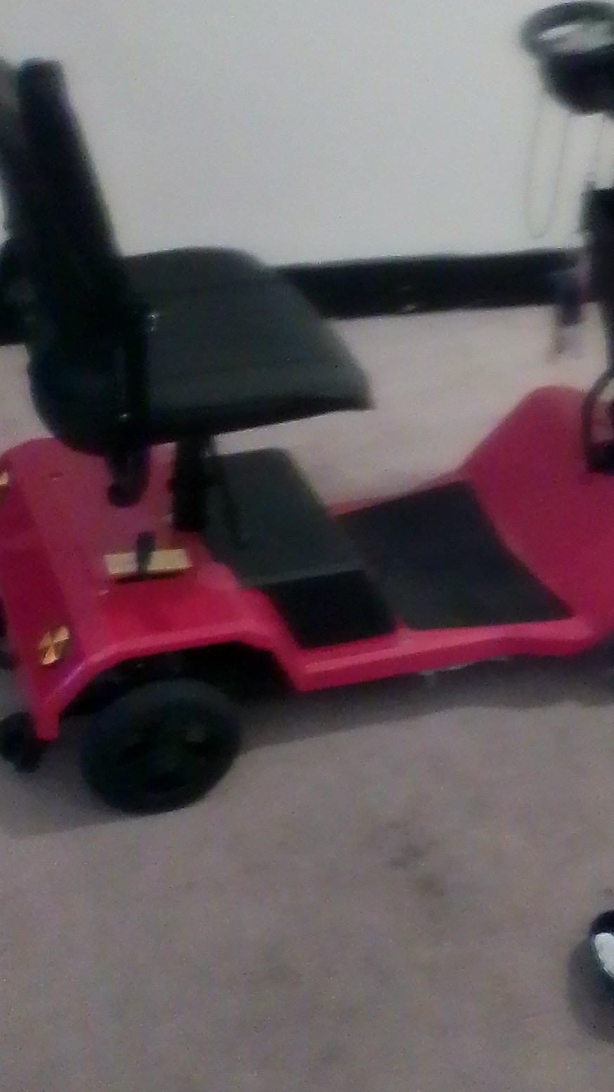 Red 4-Wheeled Mobility Scooter with Basket and Padded Armrest