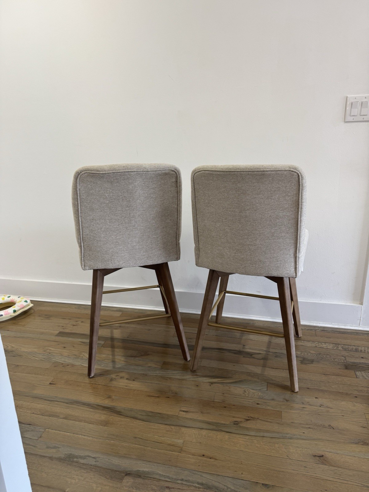 Pair of Beige Upholstered Mid-Century Modern Barstools with Wooden Legs