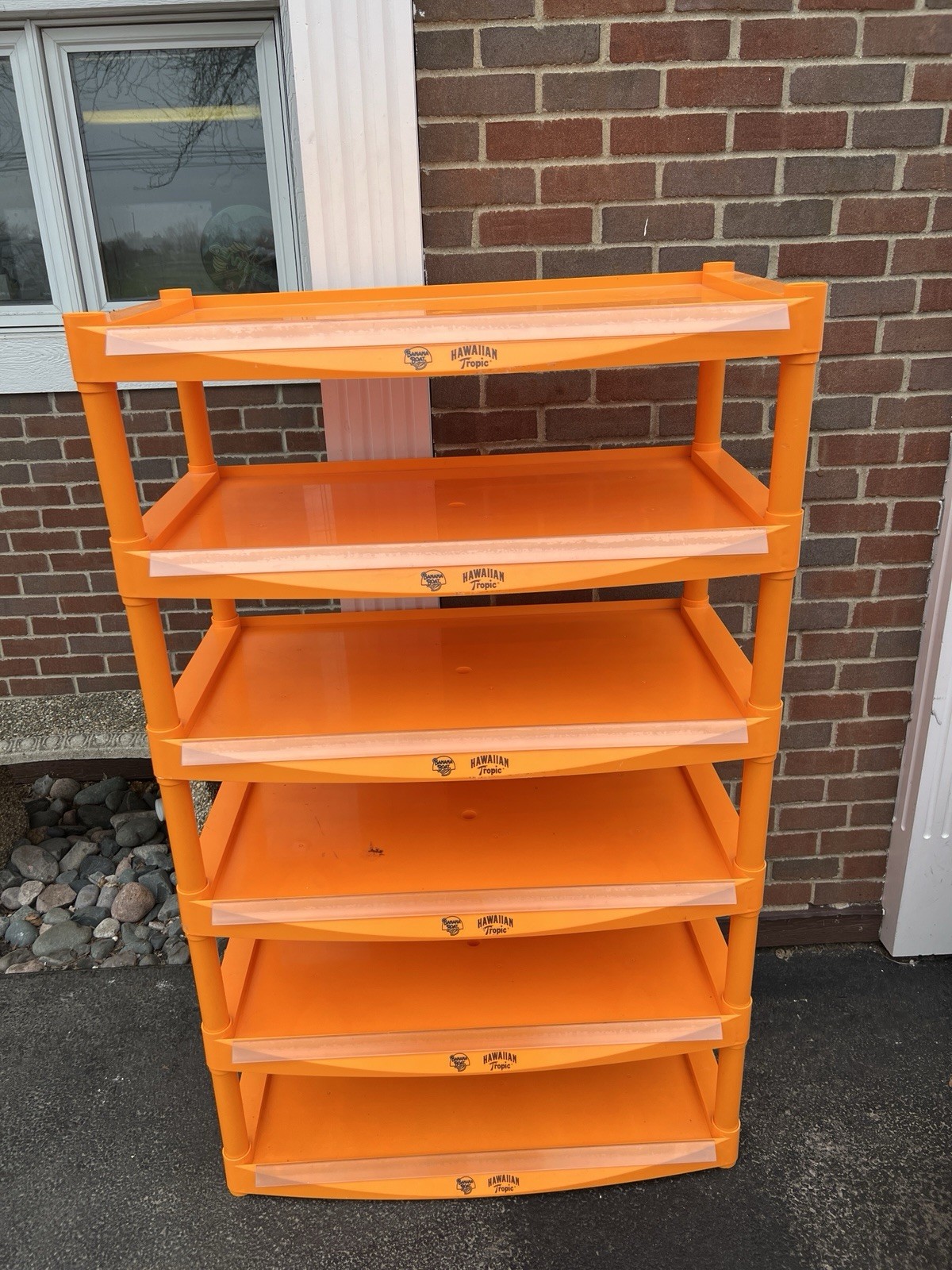 6 tier banana boat and Hawaiian tropics shelving unit With Wheels