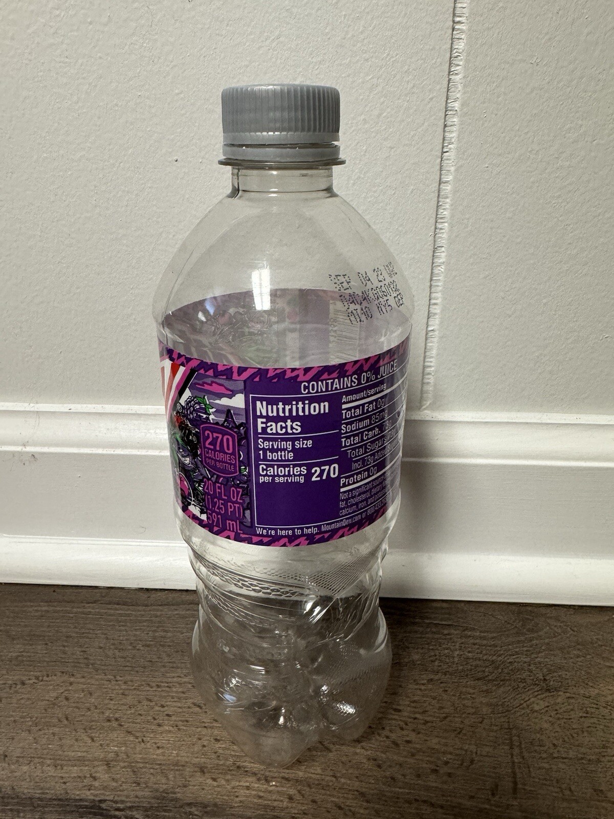 Empty Mountain Dew Purple Thunder 20 oz bottle