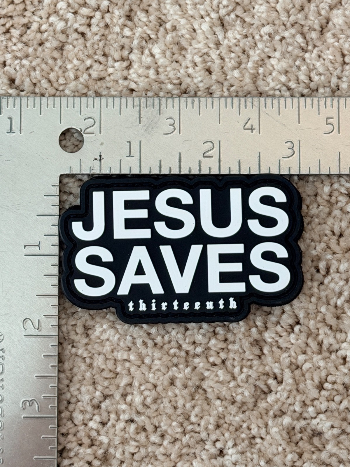Jesus Saves PVC patch, hook&loop, 3"x2", white text and black background